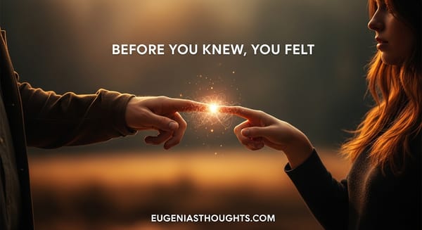 Man and woman parting hands with glowing energy between their fingertips, symbolizing soul connection and entangled frequencies beneath a golden sunset.