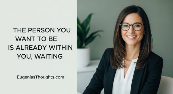 Smiling woman in glasses, sitting confidently at a desk, symbolizing the message: the person you want to be is already within you, waiting to emerge.