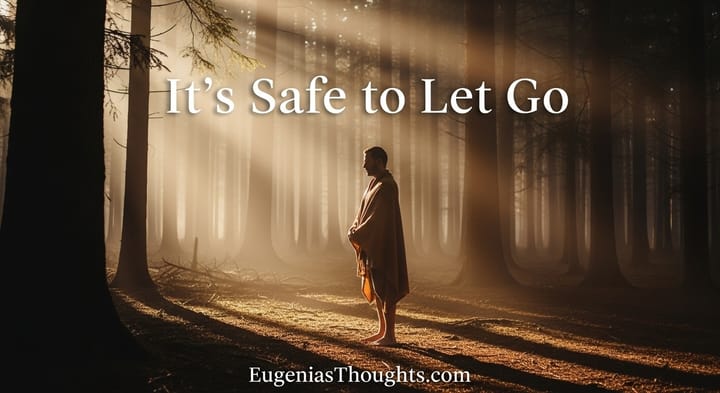 A barefoot man stands peacefully in a misty forest at sunrise, wrapped in a shawl. Light streams through the trees. Text reads: “It’s Safe to Let Go” with EugeniasThoughts.com below.